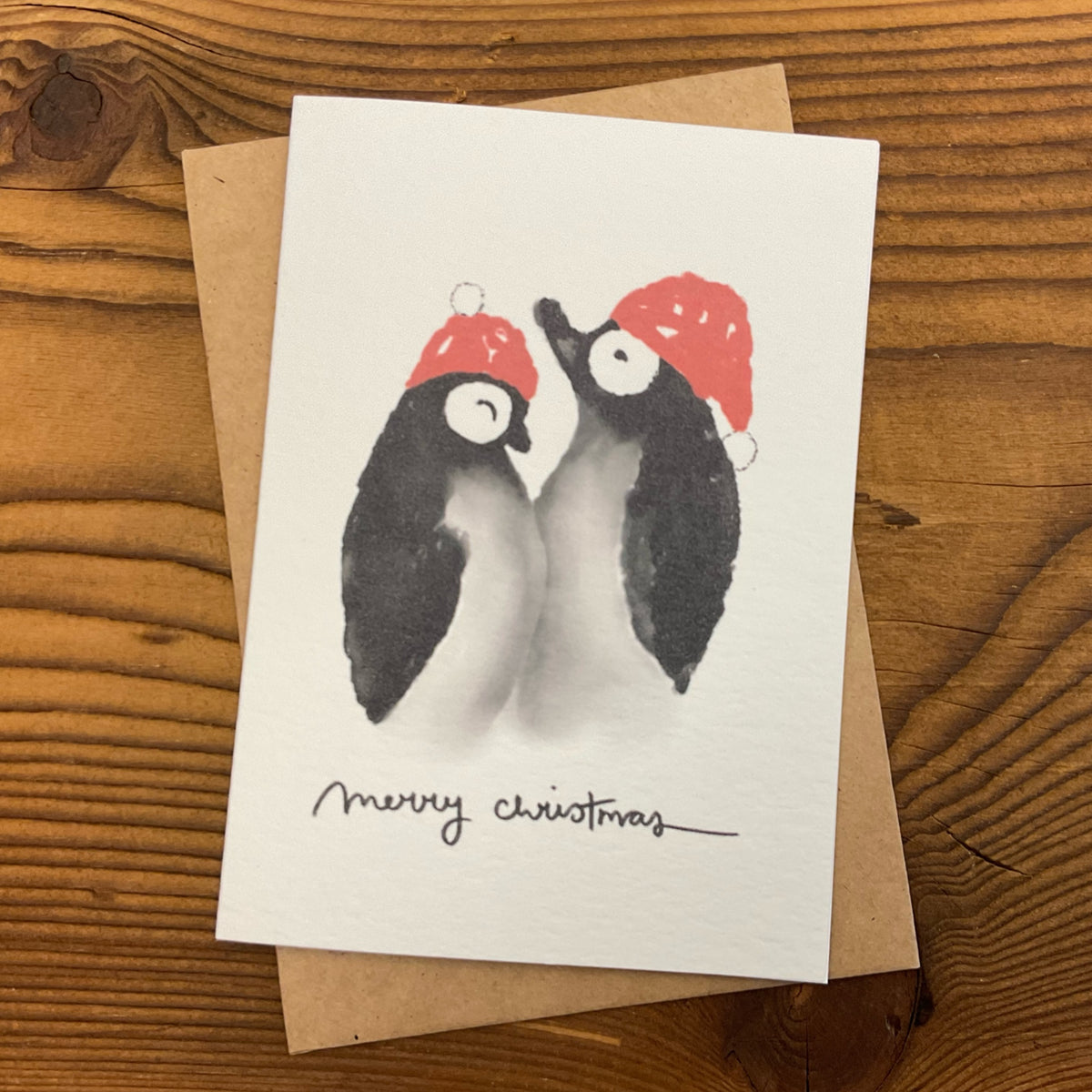 Weihnachtskarte Pinguine Merry Christmas von KicomiArt mit Couvert aus Kraftpapier